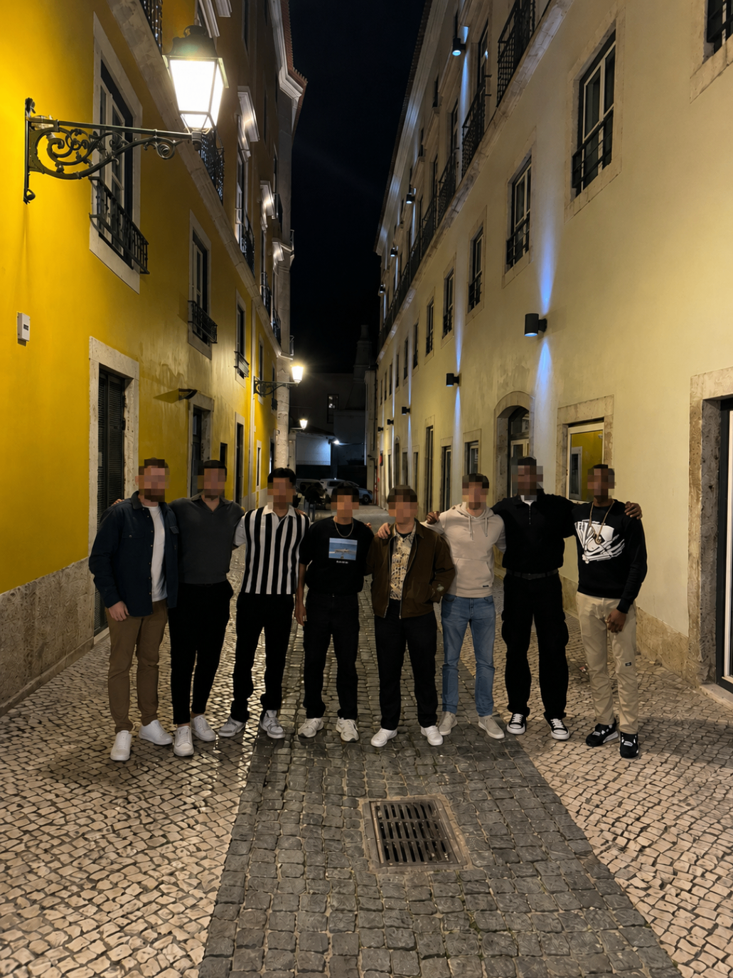 Brotherhood meetup standing together in a lit city street at night