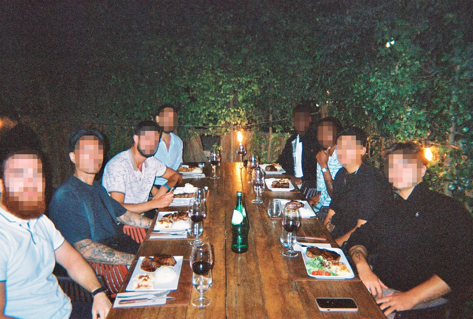 Brotherhood dinner meetup around a long table at night